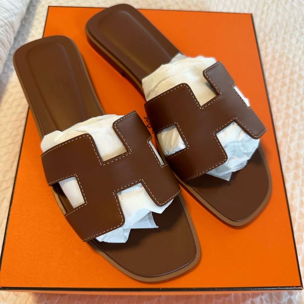 New with tags, never worn Hermes Oran sandal. Size 38, brown